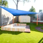 Sandstone and timber sandpit