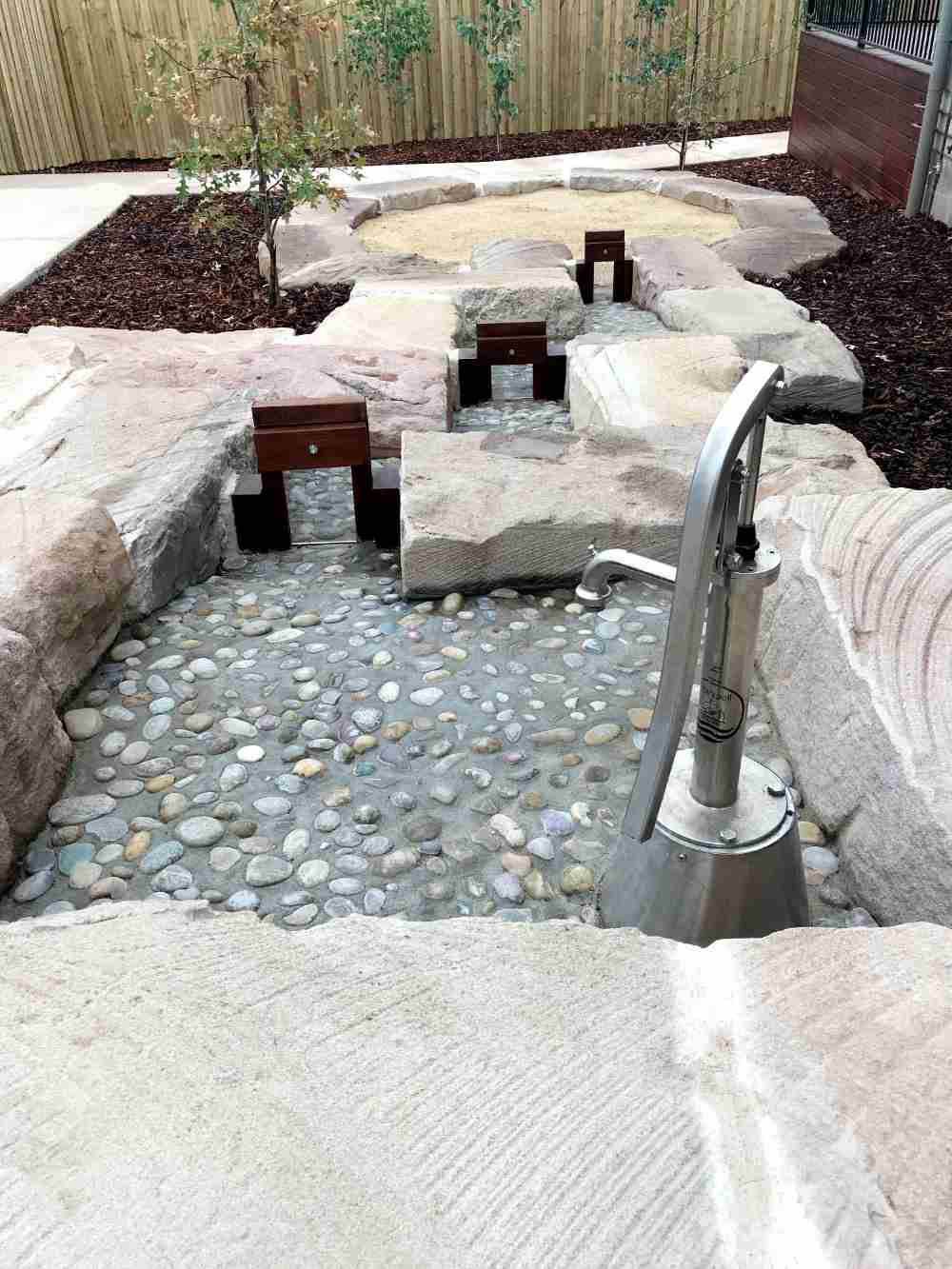 Water feature brick and pebbled concrete