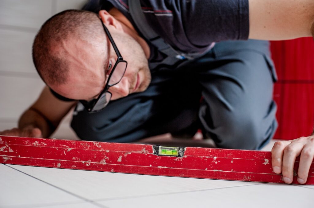 Floor maintenance professional using his tools