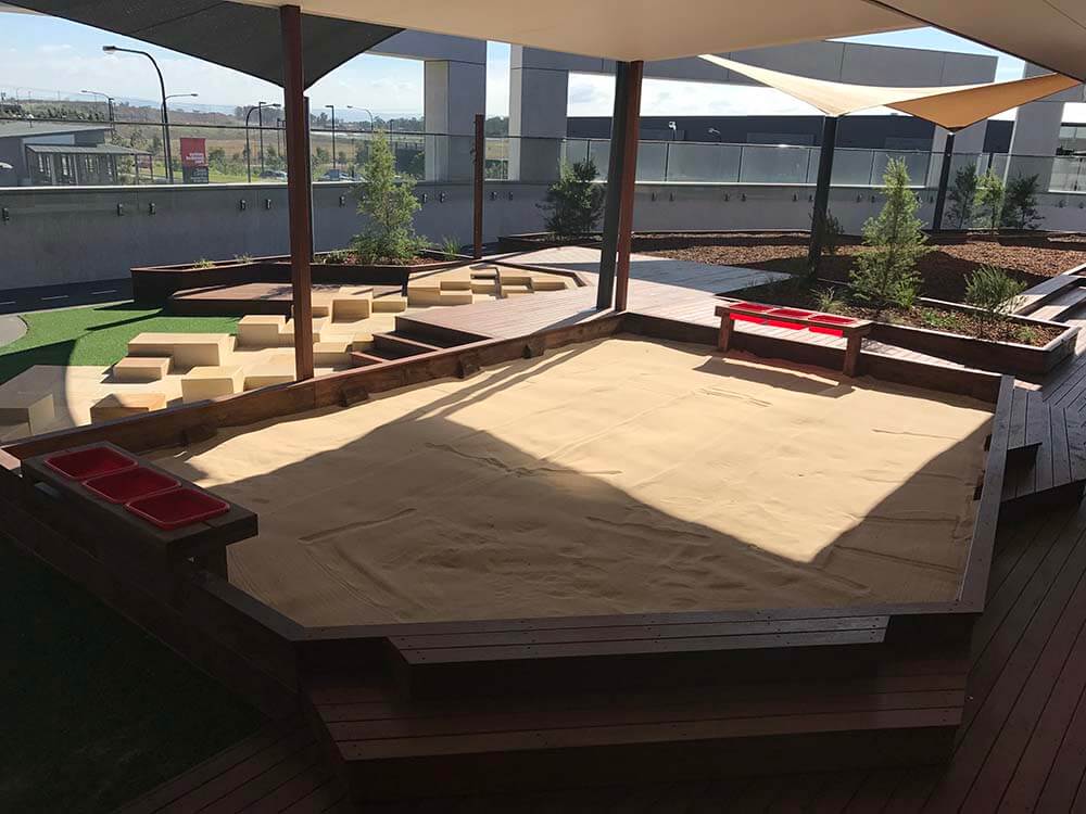 Sandstone and timber sandpit