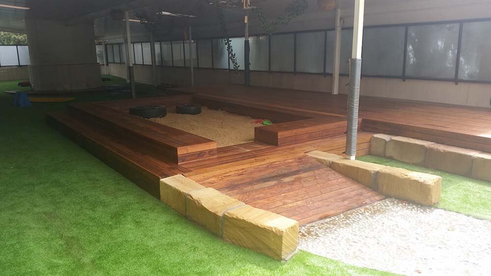 Sandstone and timber sandpit